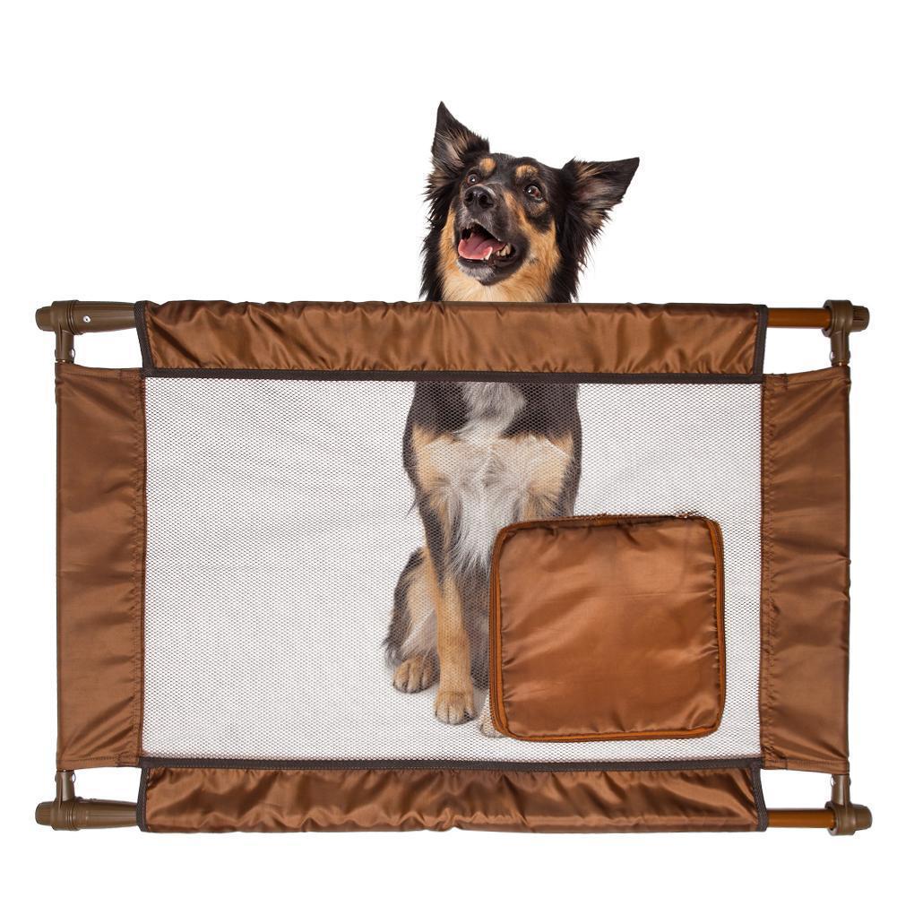 Collapsible pet safety gate, brown nylon mesh with square zip door, with dog behind it