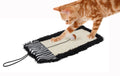 Brown tabby cat on black sisal/jute hanging carpet cat scratcher with hanging cord