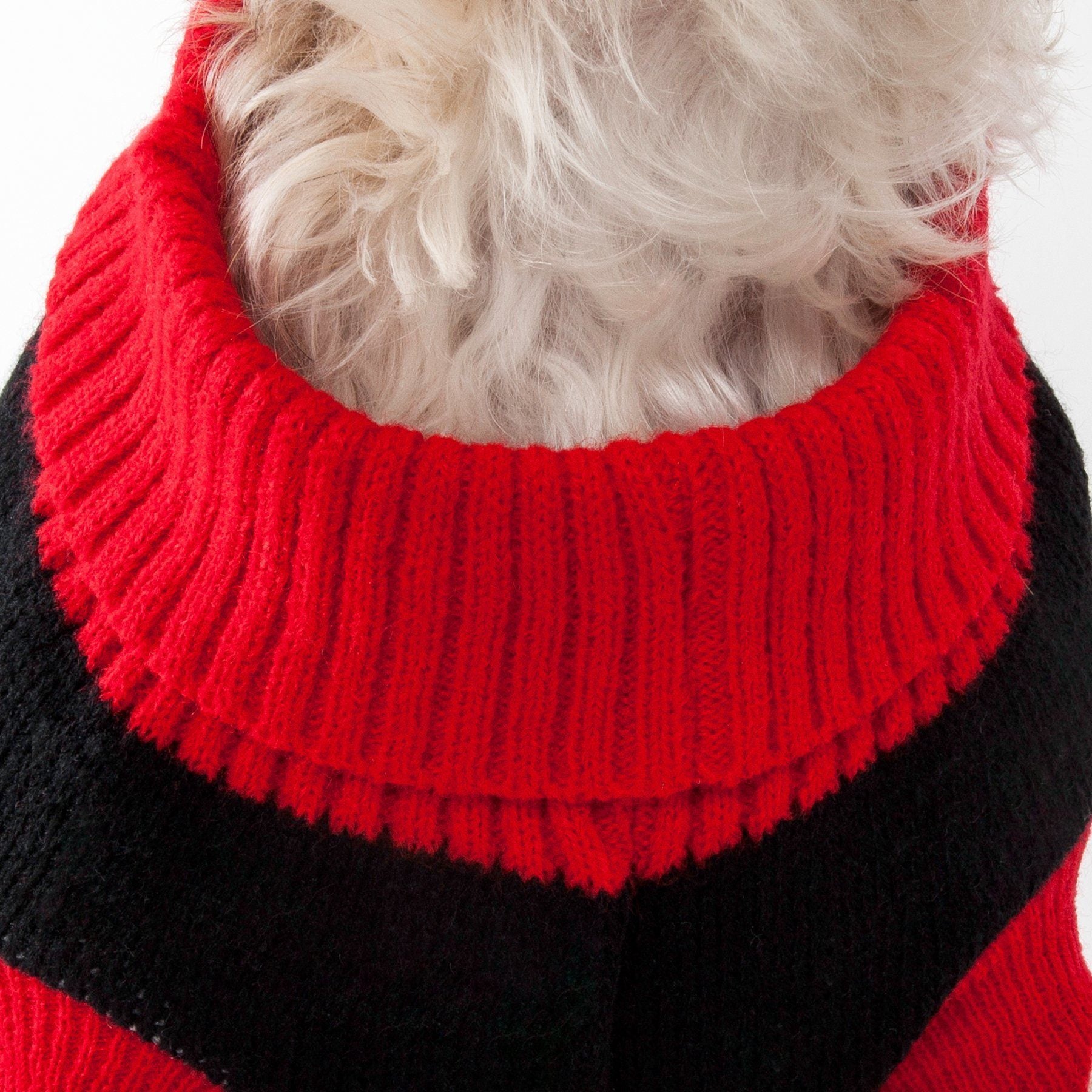 Close-up red and black knit dog sweater with ribbed turtleneck collar