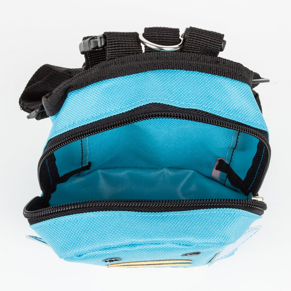Top view of blue dog harness backpack with open zipper and black interior webbing
