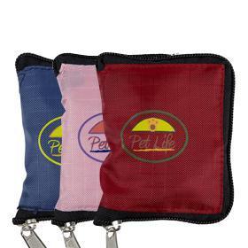 Foldable zippered pet travel bowls in blue, pink, and red, packed and stacked