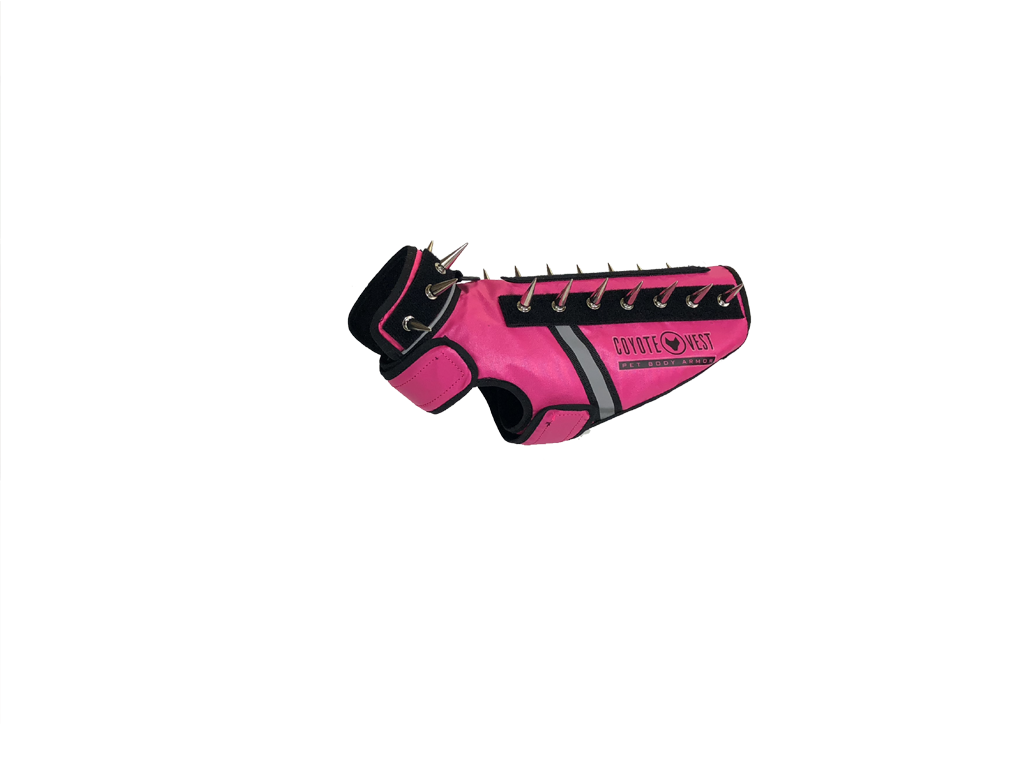 SpikeVest spiked vest with black side panels, hot pink body, and metal spike row on top