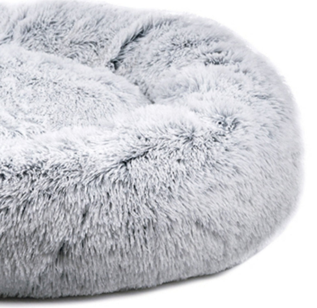 Snowflake white two-tone plush pet bed with thick raised outer rim and hollow center