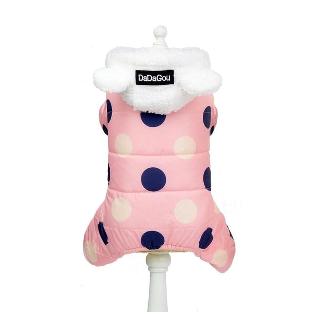 Pink polka-dot snowsuit jumpsuit with fluffy white hood and navy spots