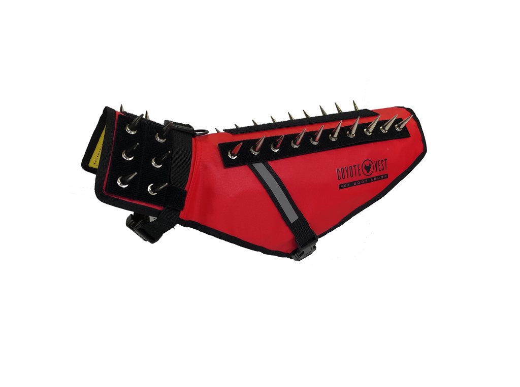Red pet vest with black spikes, D-ring leash clip, and adjustable side straps