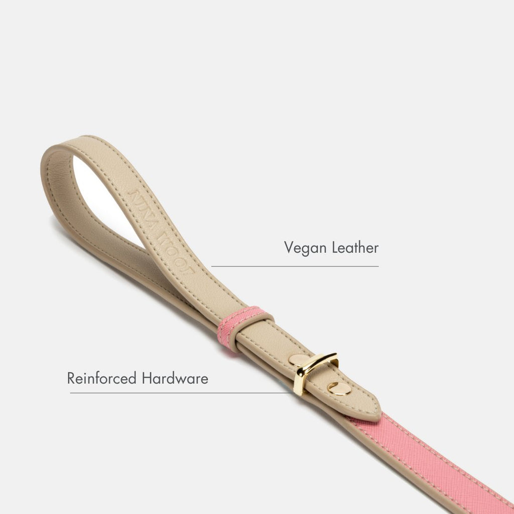 Beige vegan leather dog leash with pink center panel and gold buckle clasp