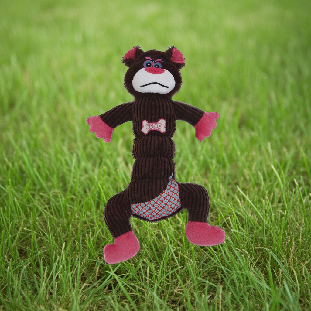 Dark brown plush dog toy with pink paws and mesh belly panel, squeaky-style design