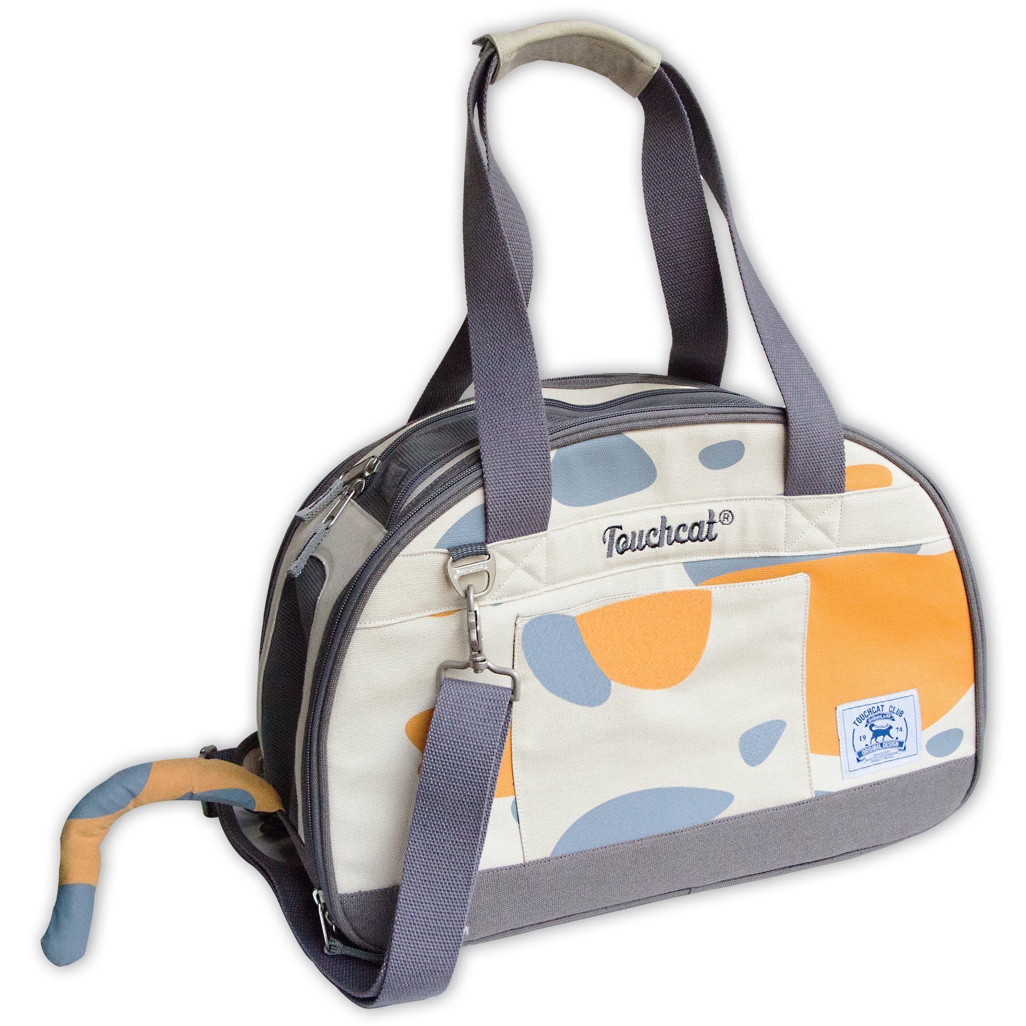 Cream collapsible cat carrier with blue/orange abstract print, front zipper, plush tail