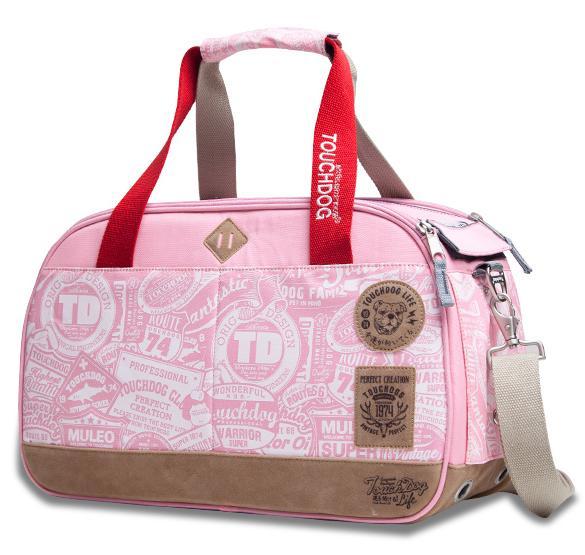 Pink pet carrier duffel with red handles, front zipper, and printed vintage-style logos