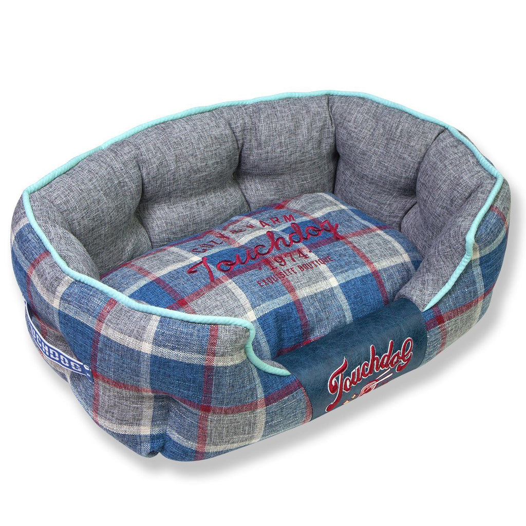 Blue plaid oval dog bed with gray interior and light blue trim