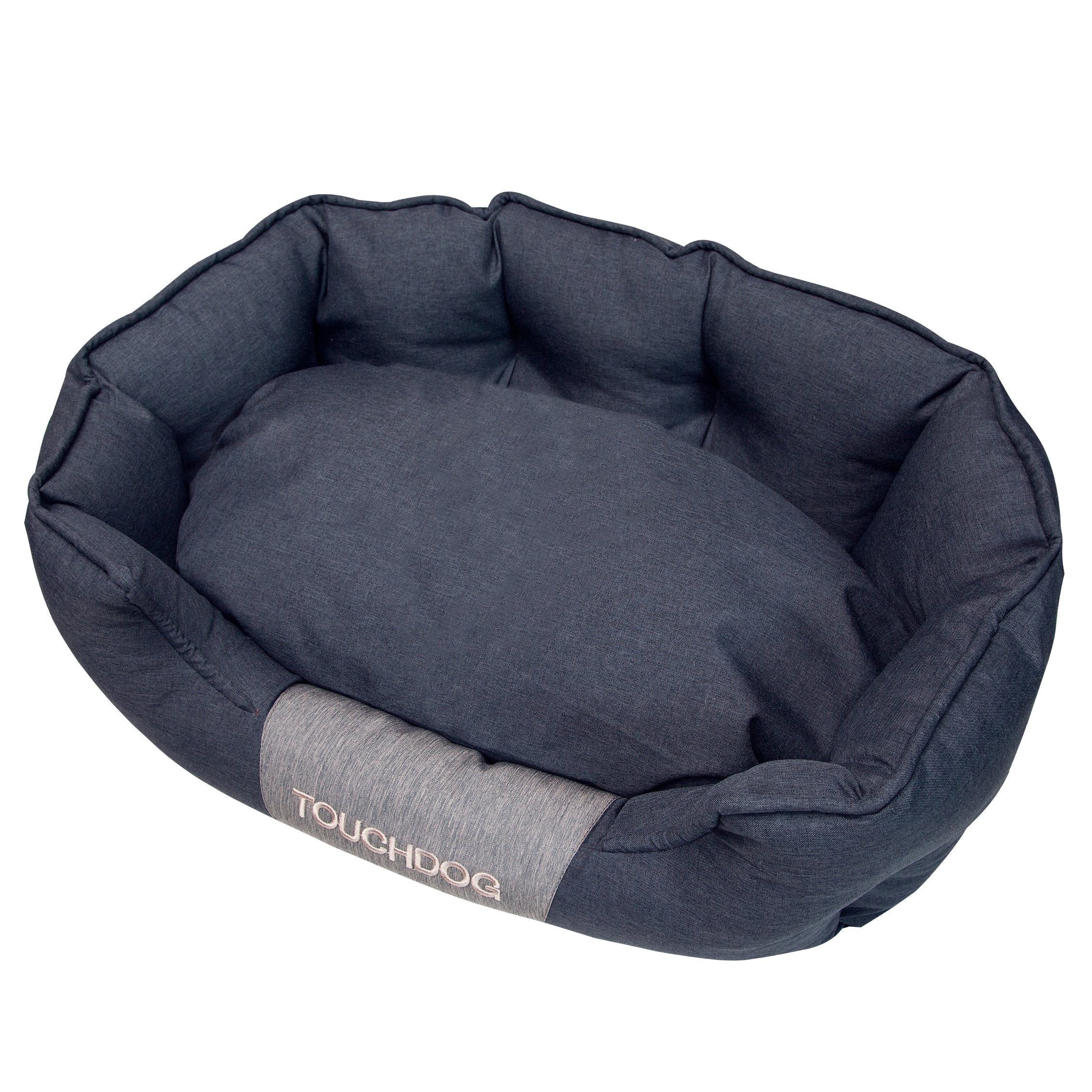 Charcoal gray oval dog bed with padded bolstered edges and cushioned center
