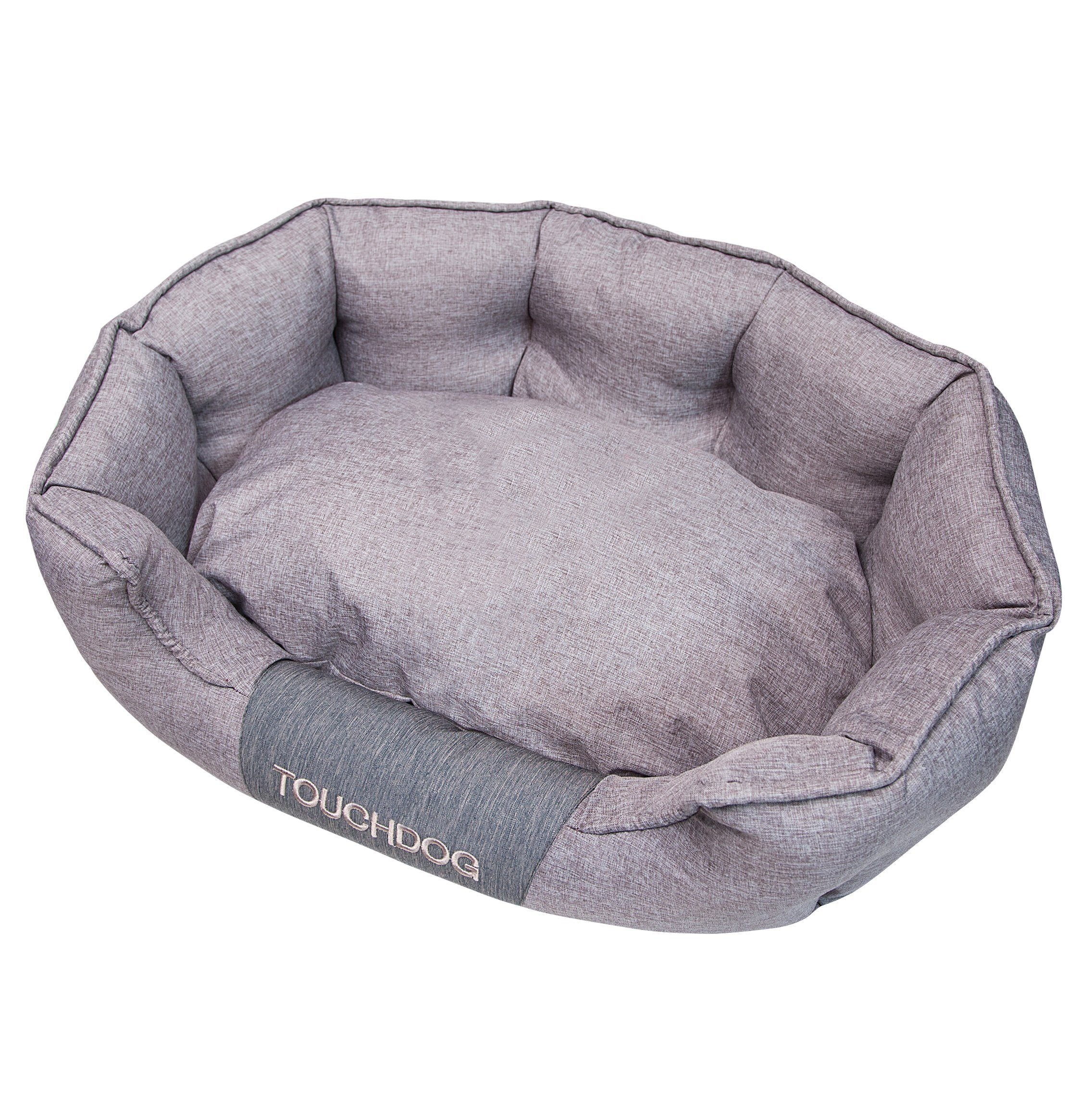 Gray oval dog bed with padded sides and soft cushioned base, water-resistant fabric