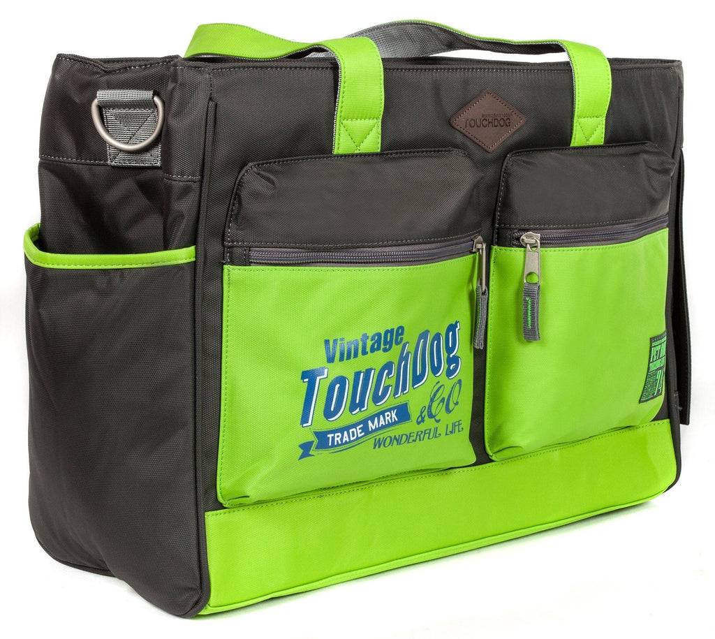 Black pet dog carrier bag with lime green panels, front zip pockets, and shoulder strap