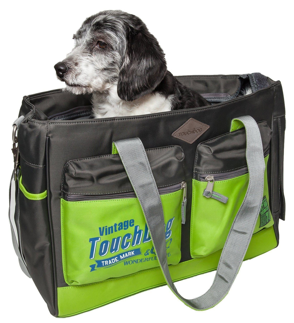 Black pet dog carrier bag with neon green front panels, zip pockets, and shoulder strap