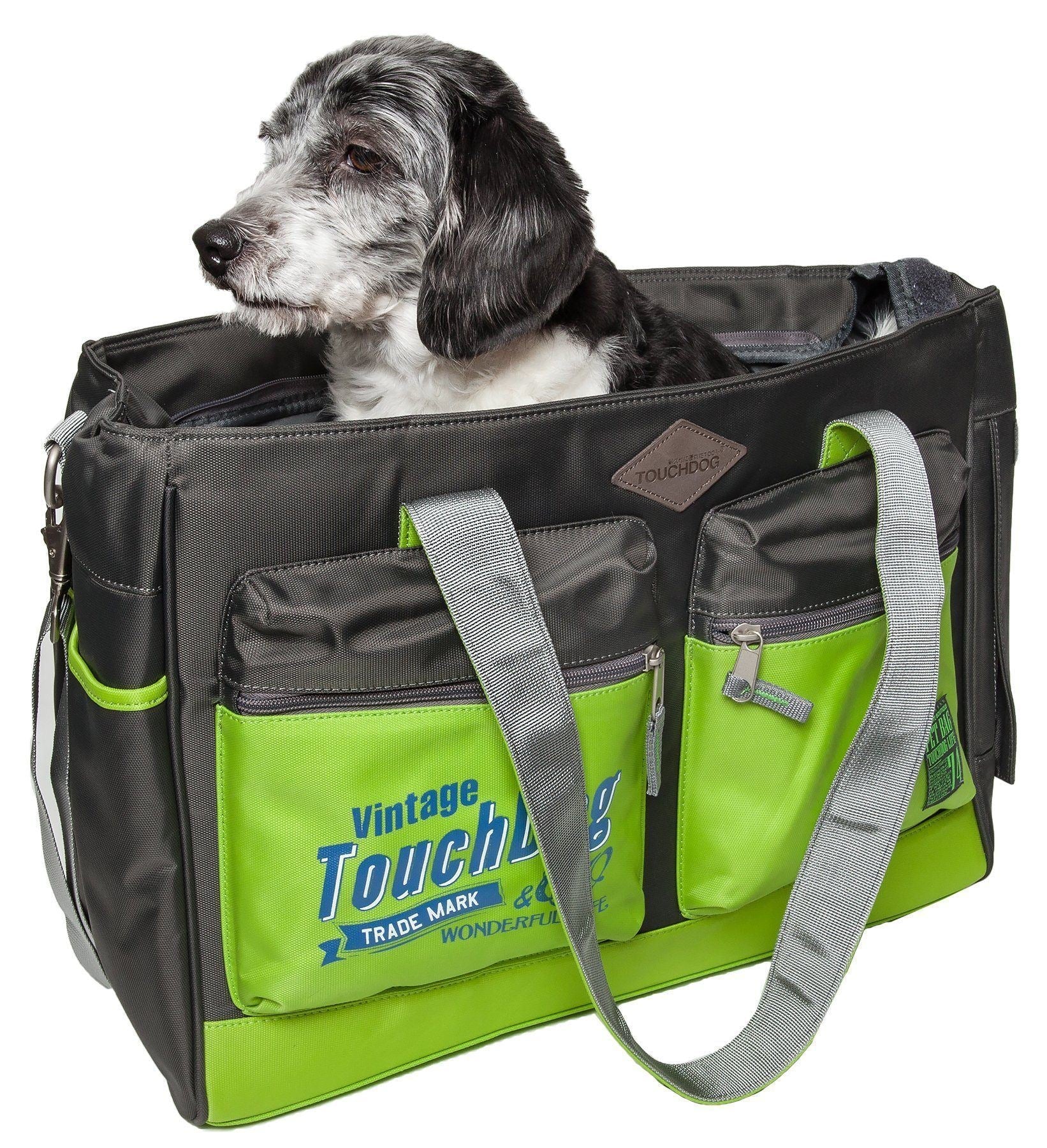 Black pet dog carrier bag with neon green front panels, zip pockets, and shoulder strap
