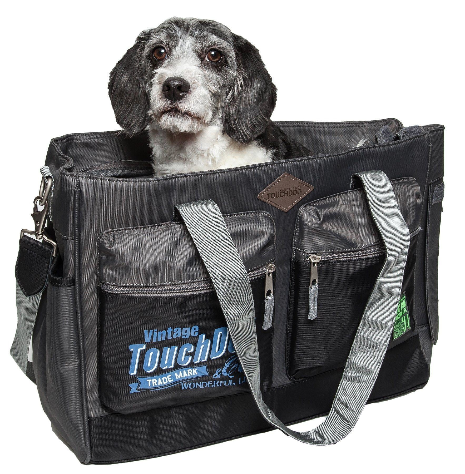 Black water-resistant pet dog carrier bag with front zip pockets and shoulder strap