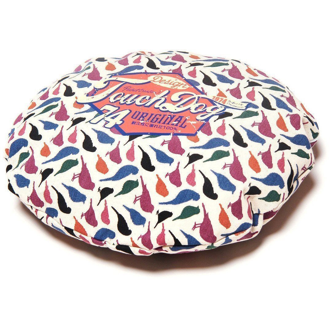 Rounded dog bed cover top view with colorful bird silhouettes on a white background