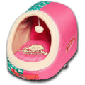 Pink panoramic cat bed close-up of tunnel entrance with hanging pom teaser toy