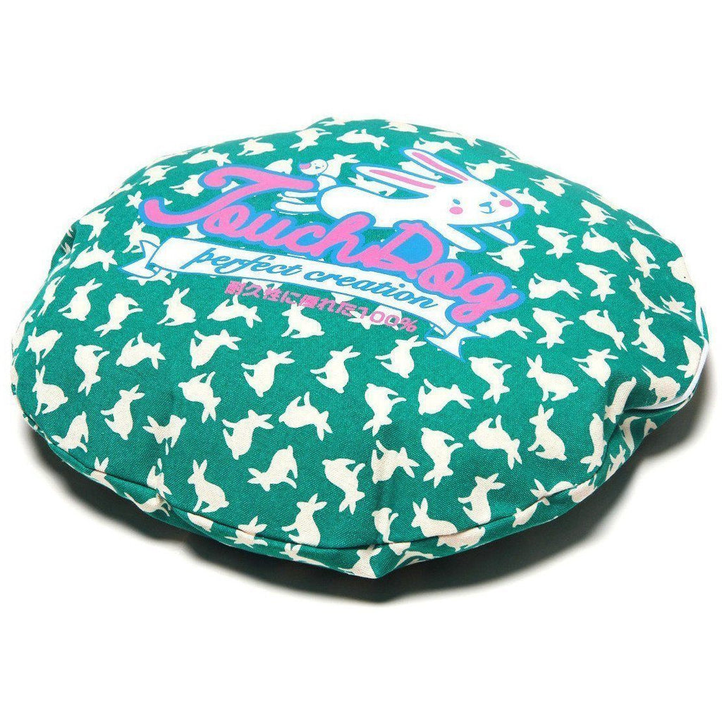 Teal rabbit-spotted dog bed cushion with “Perfect creation” graphic