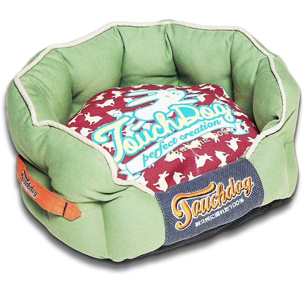 Green rounded dog bed with red rabbit-pattern cushion and navy “Sauchdog” panel