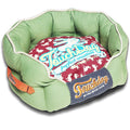 Green rounded dog bed with red rabbit-pattern cushion and navy “Sauchdog” panel