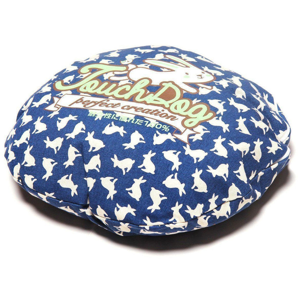 Navy rabbit-spotted dog bed cushion with colorful “Perfect creation” text