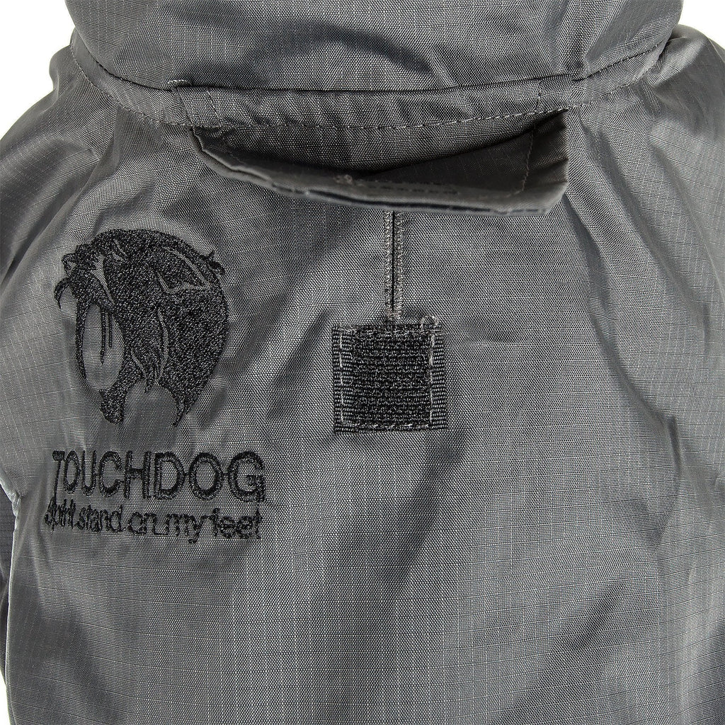 Charcoal/black waterproof dog jacket close-up with hood and logo patch