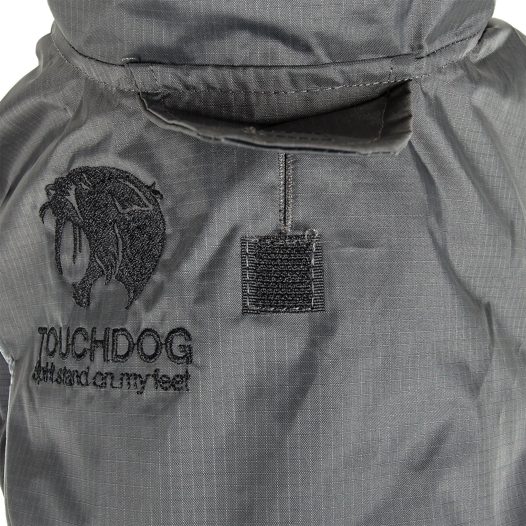 Charcoal/black waterproof dog jacket close-up with hood and logo patch
