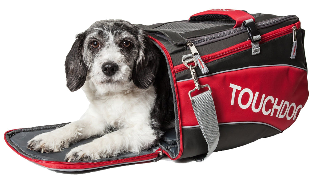 Red and black airline pet carrier with zipper opening and adjustable shoulder strap.