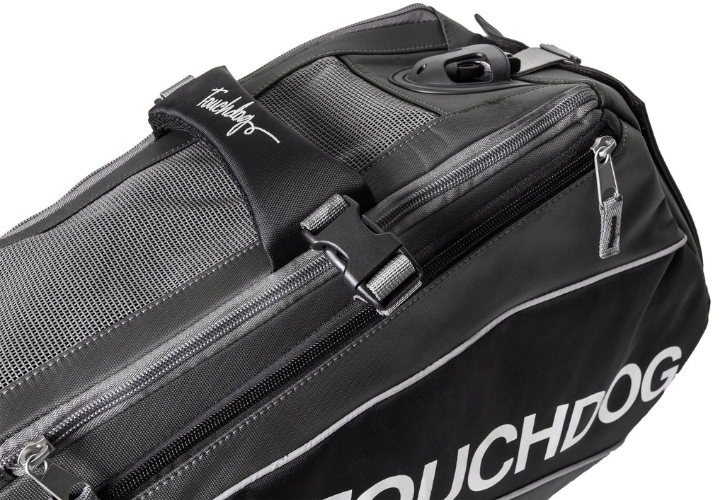 Black pet carrier close-up with front zipper and padded side panel for travel.