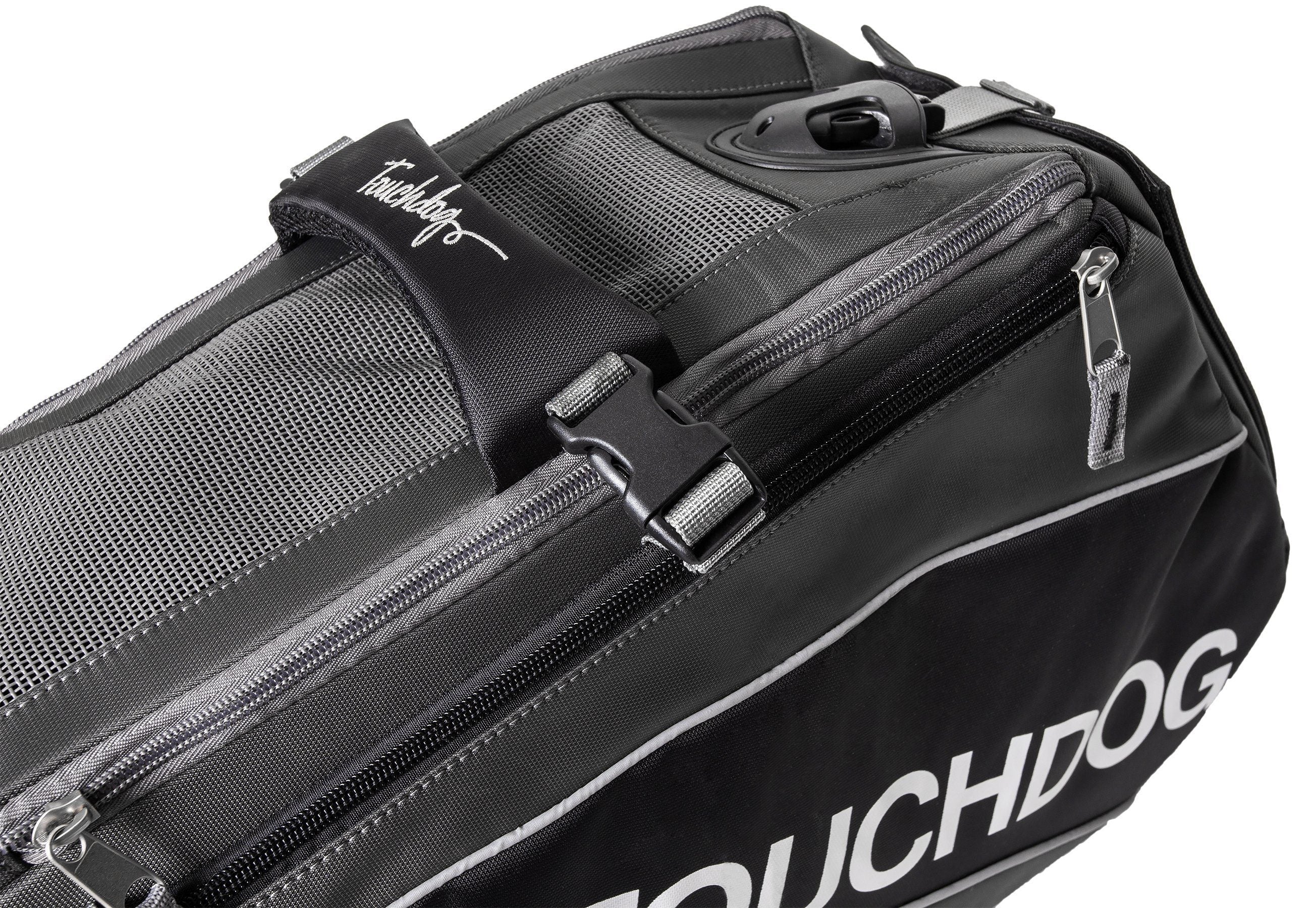Black pet carrier close-up with front zipper and padded side panel for travel.