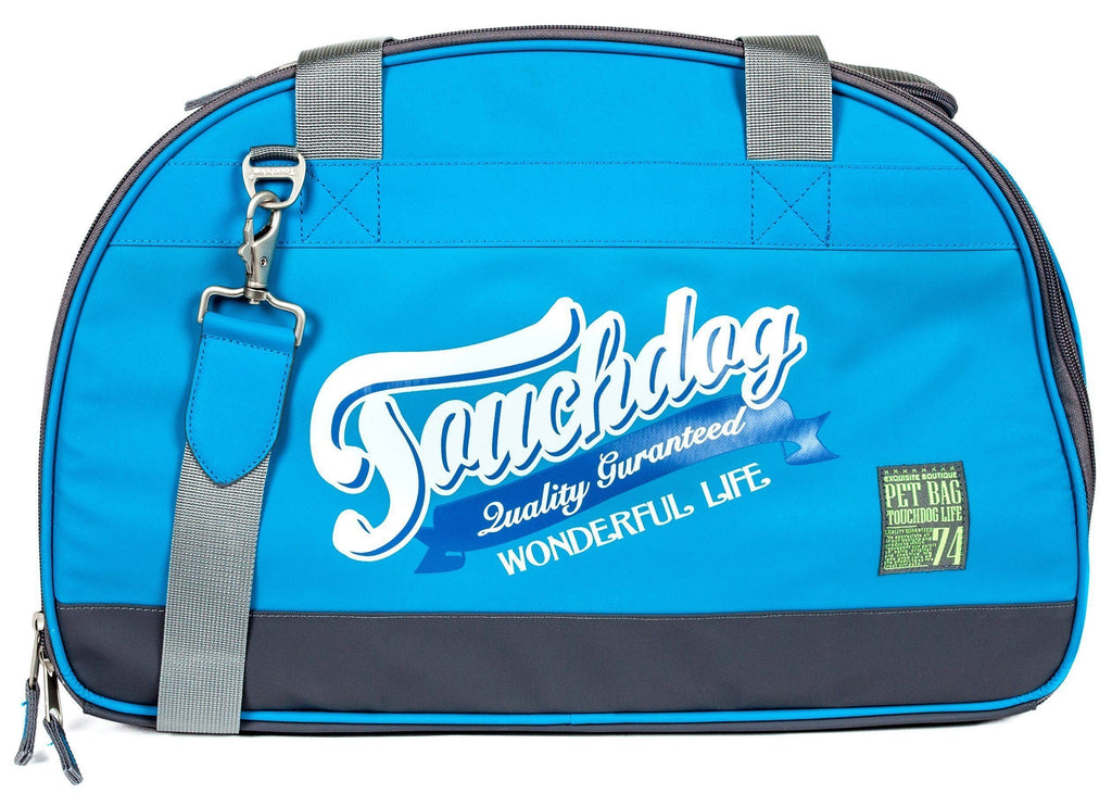 Blue airline travel dog carrier front view with logo and small green pet badge