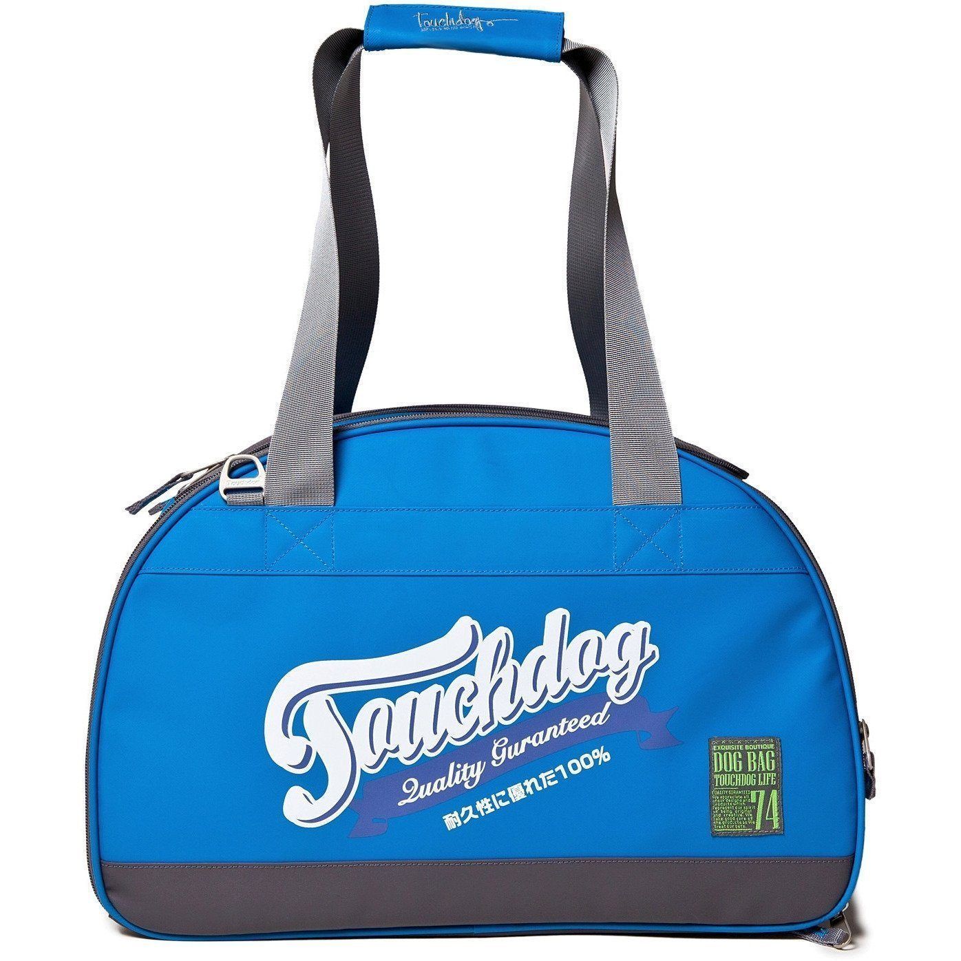 Blue airline-approved dog carrier side view with gray handles and front logo patch