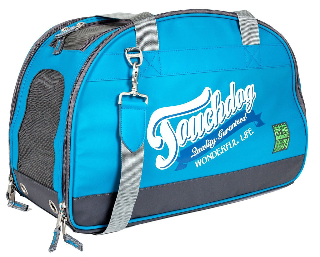 Blue airline travel dog carrier with front logo, gray shoulder strap, zipper pockets