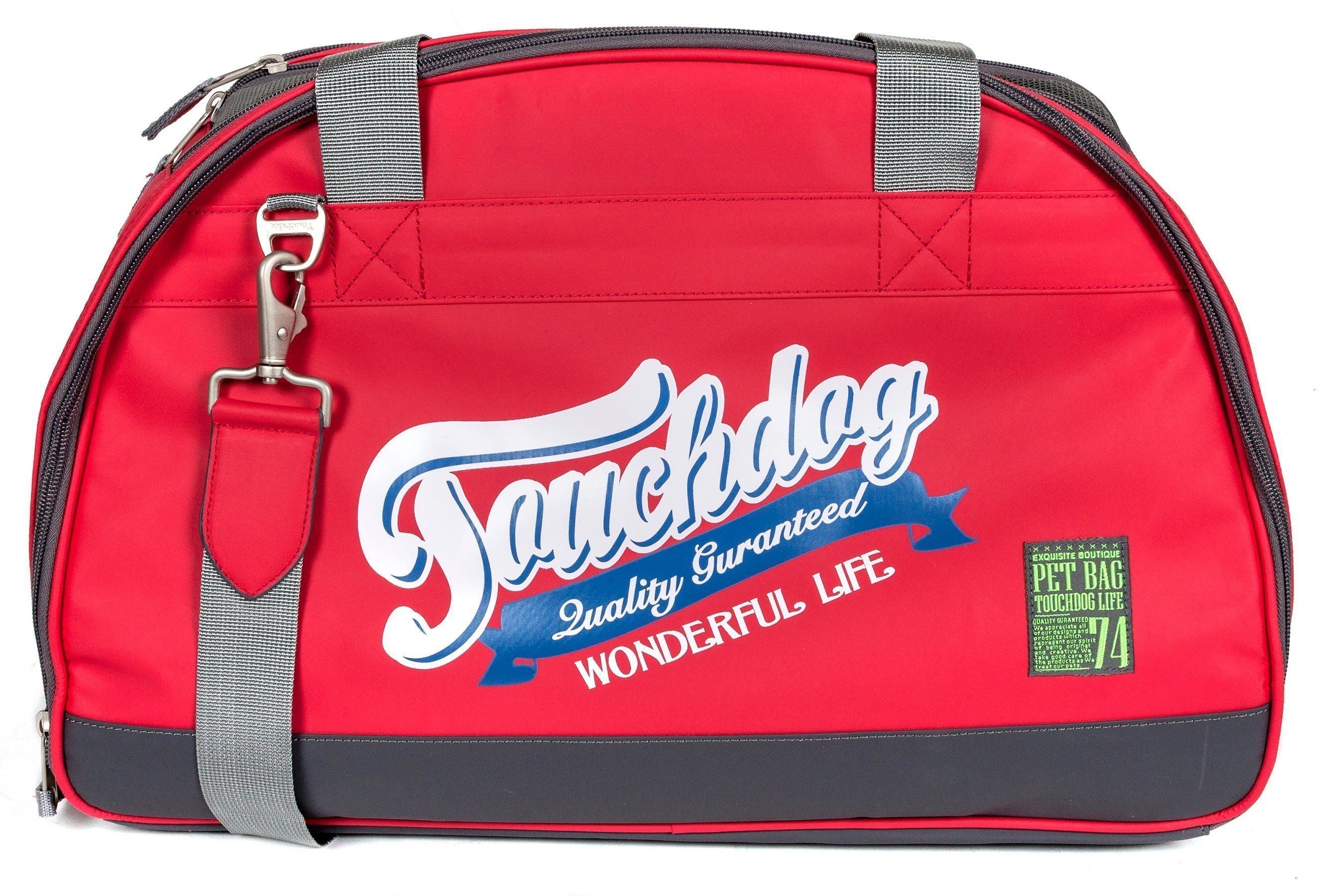 Red airline travel dog carrier front view with logo and green pet badge label