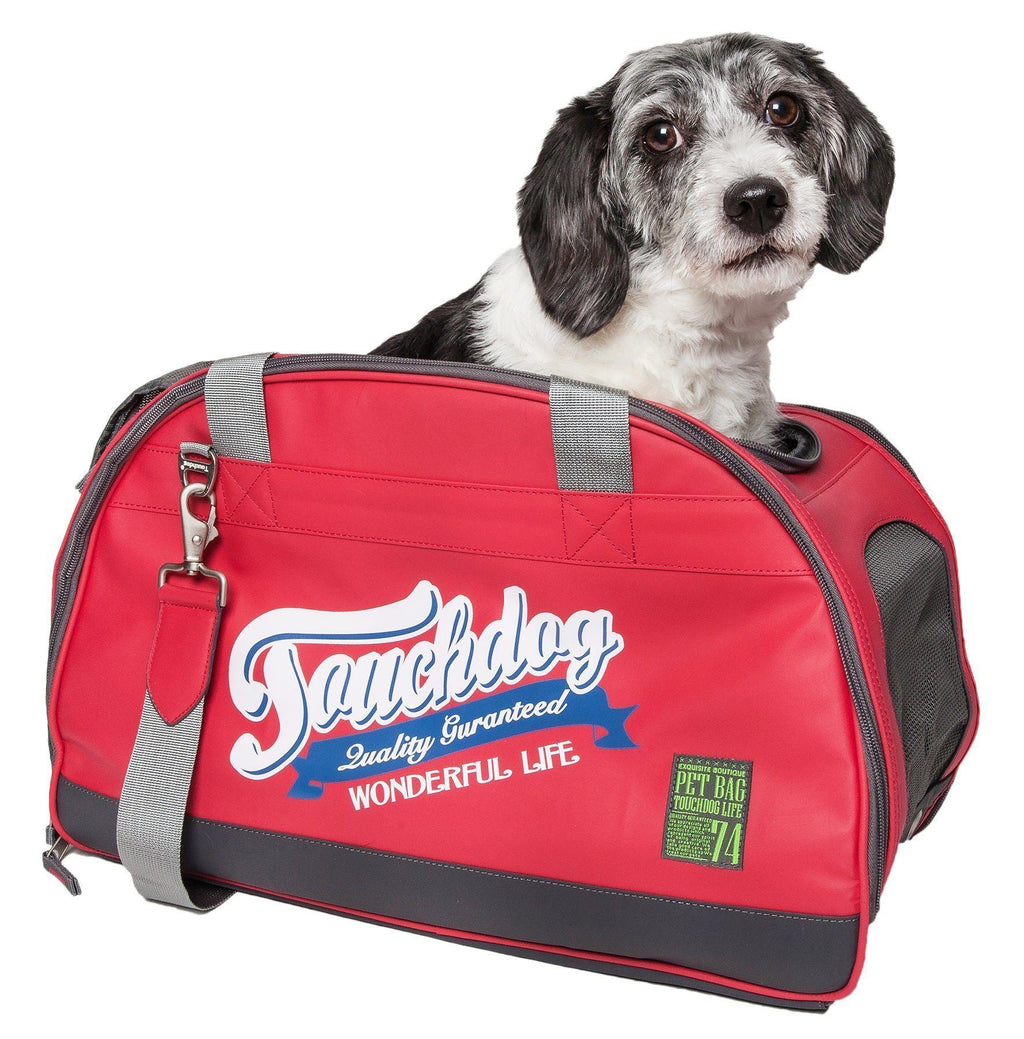 Red airline-approved dog carrier with zipper front and gray carry straps