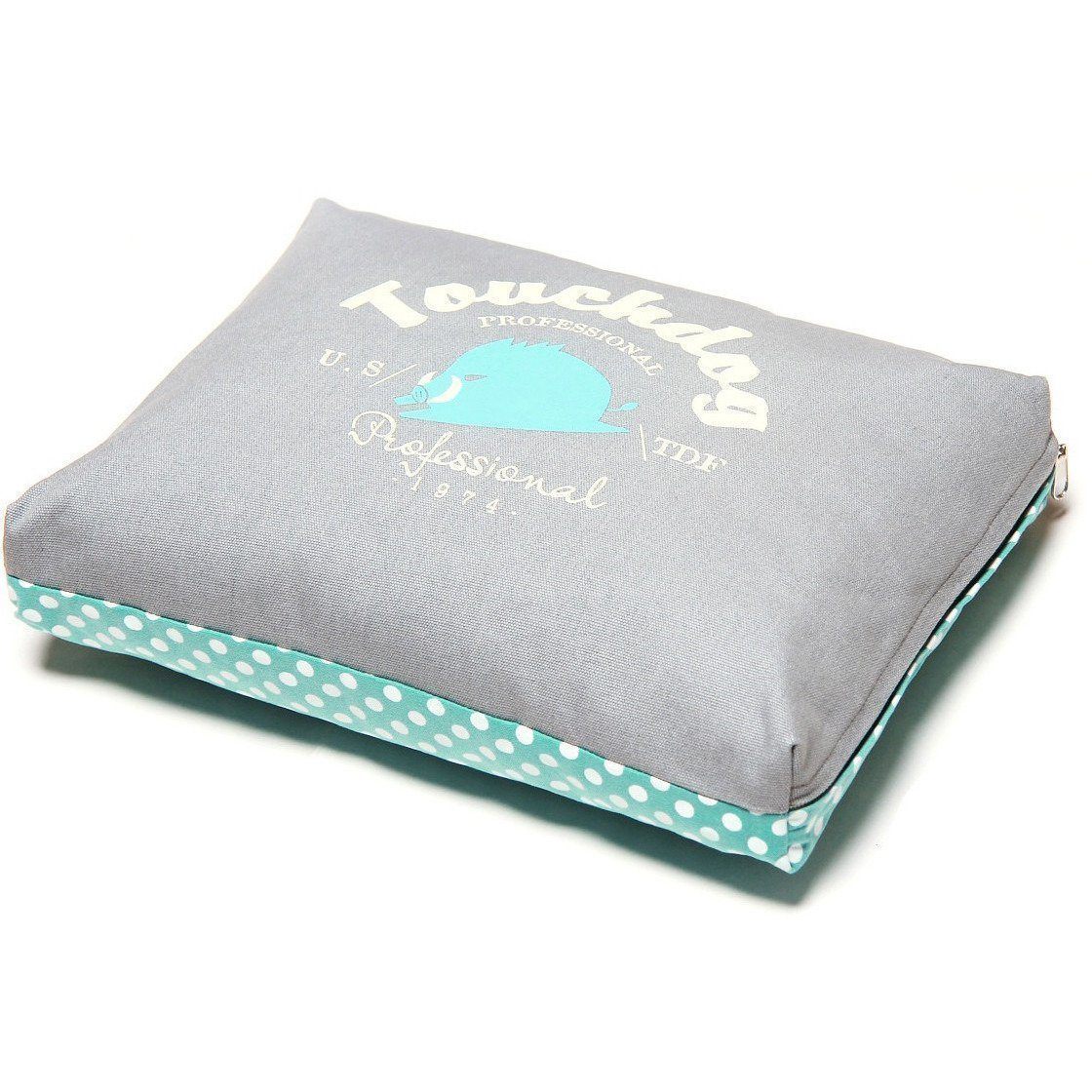 Gray rectangular dog bed cushion with teal polka-dot base lining