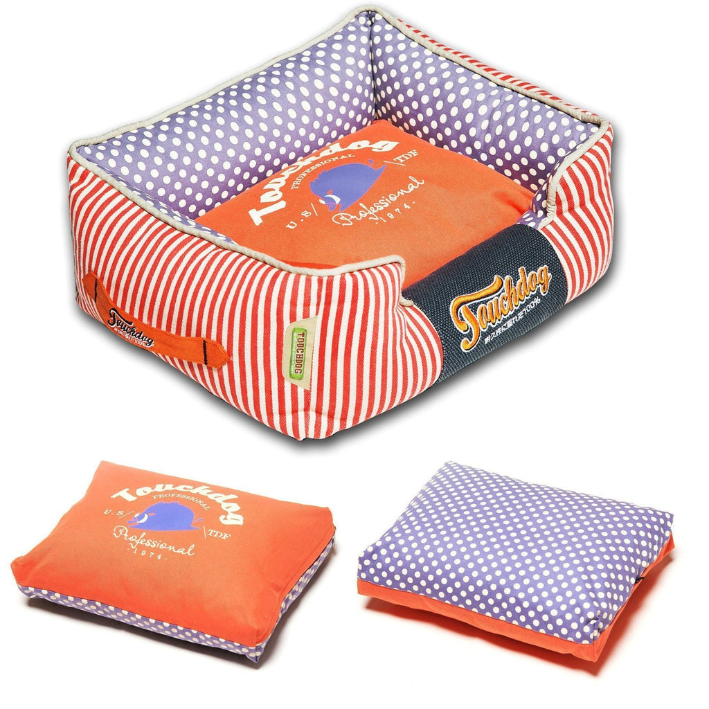 Rectangular dog bed with orange striped sides and purple polka-dot inner cushion
