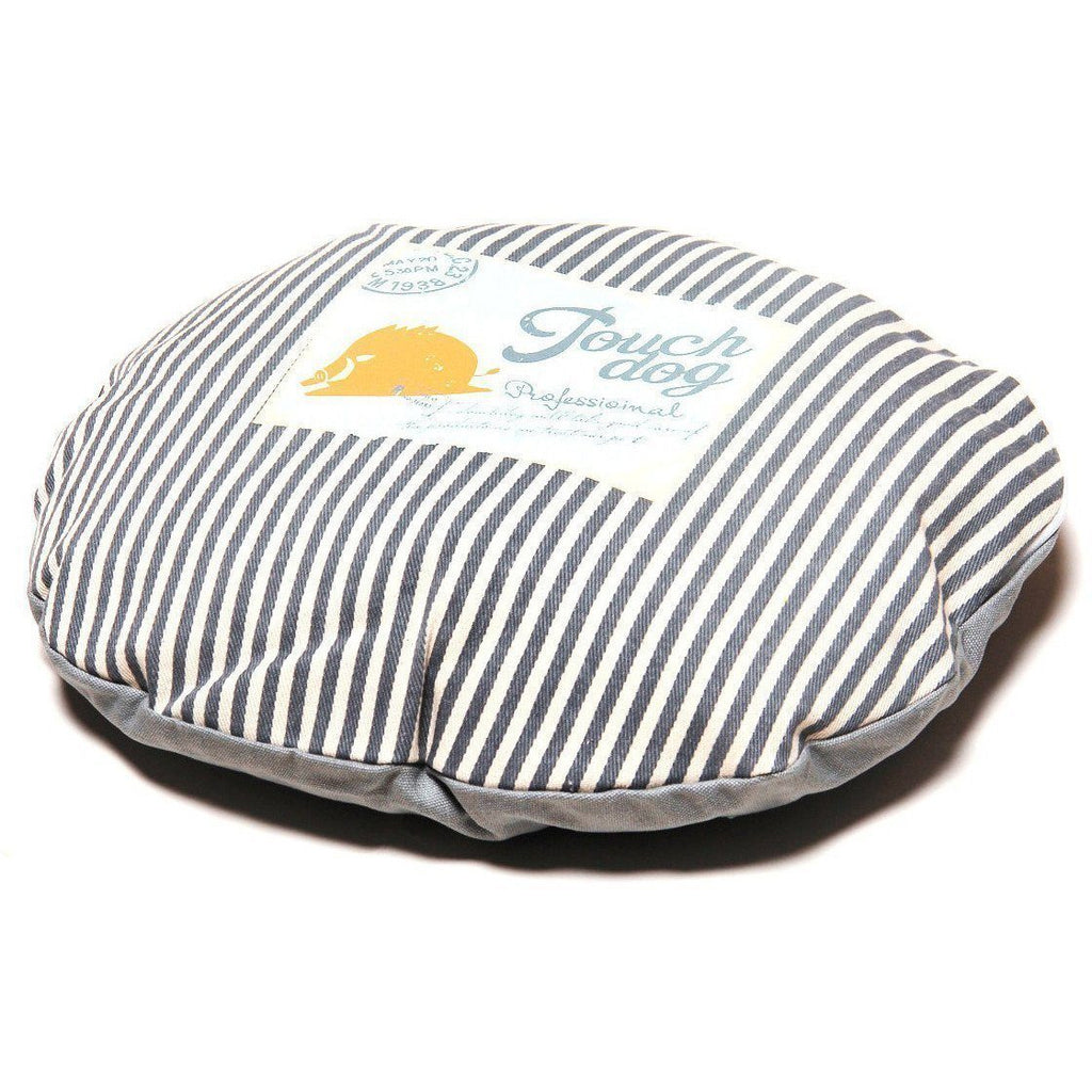 Round dog bed cover with navy-and-white vertical stripe top and smooth gray underside