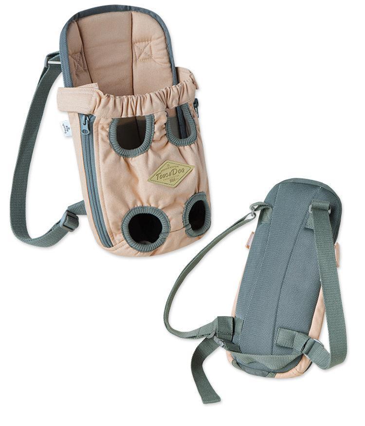 Beige dog front/back carrier with zip, round vents, and adjustable shoulder strap