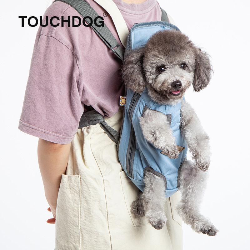 Light blue backpack dog carrier with zip front and circular vent holes, dog inside