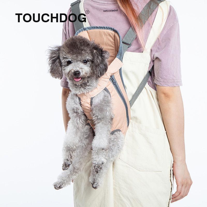 Beige backpack dog carrier with zip front and circular vents, worn with shoulder straps