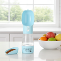 Blue portable 2-in-1 pet feeder on a table with matching food bowl
