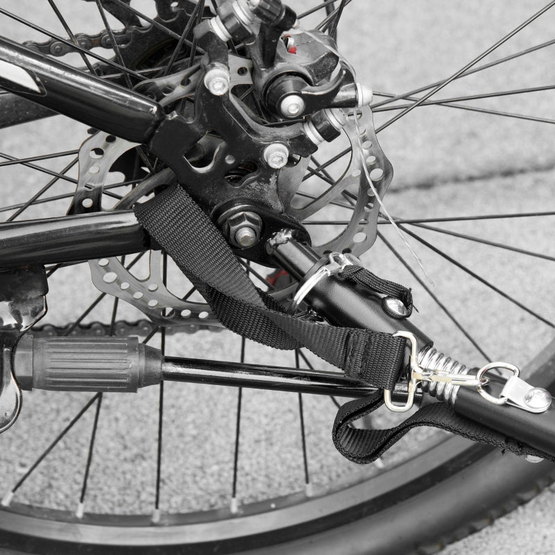 Bike trailer stroller hitch strap and frame near wheel with disc brake