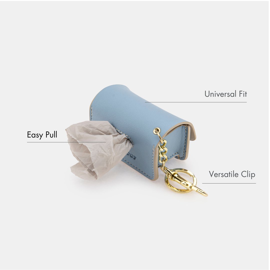 Blue waste bag dispenser showing easy-pull opening and versatile key clip