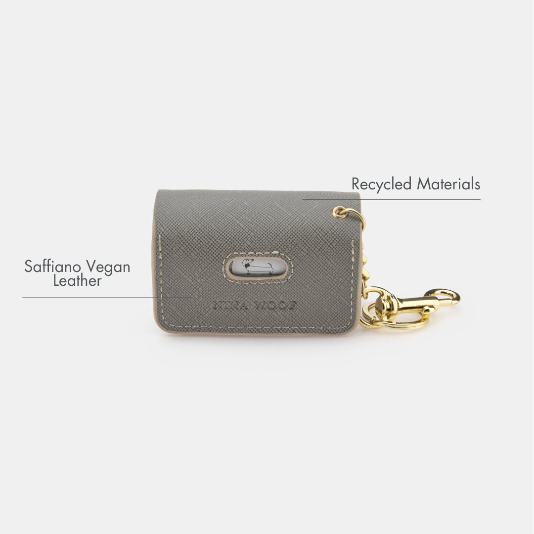 Grey embossed waste bag holder with snap closure and gold keyring clip