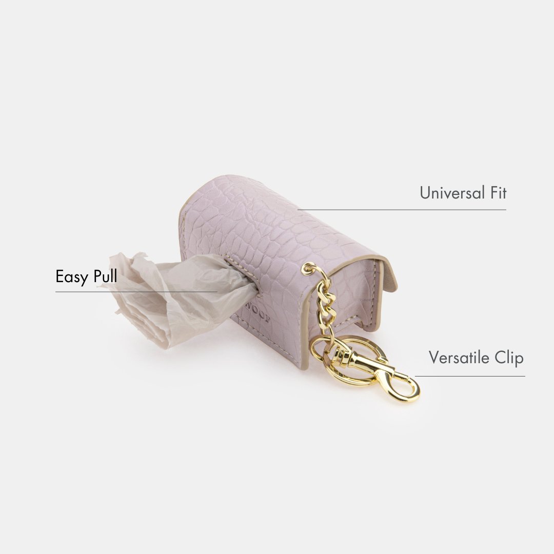 Lilac waste bag dispenser with easy-pull opening and gold clasp keyring