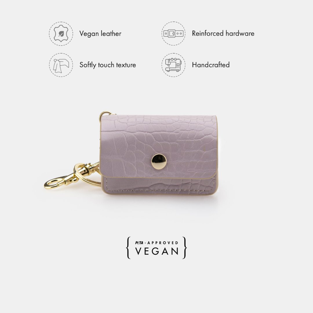 Lilac vegan leather waste bag holder with snap front and gold ring hardware