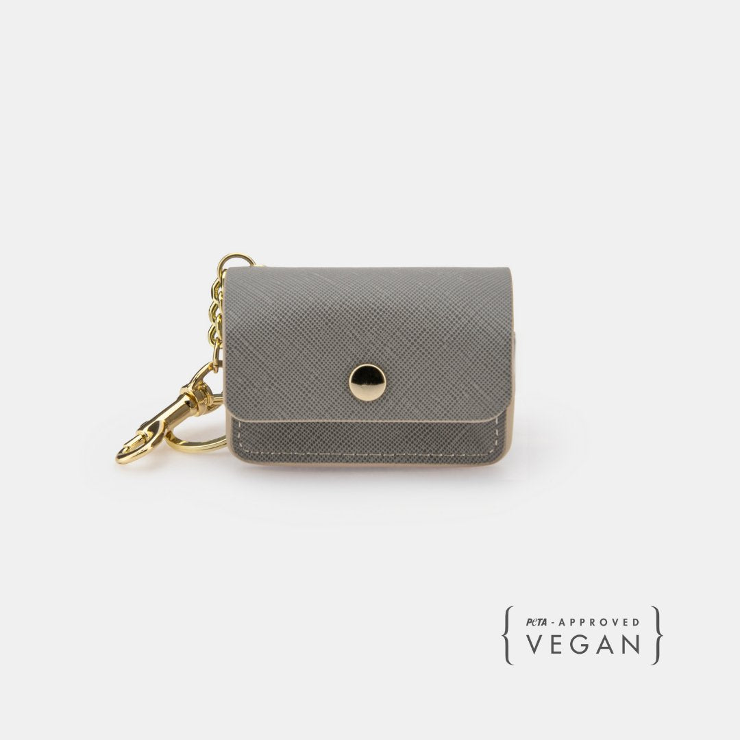 Grey vegan leather waste bag holder with snap button and gold keyring clip