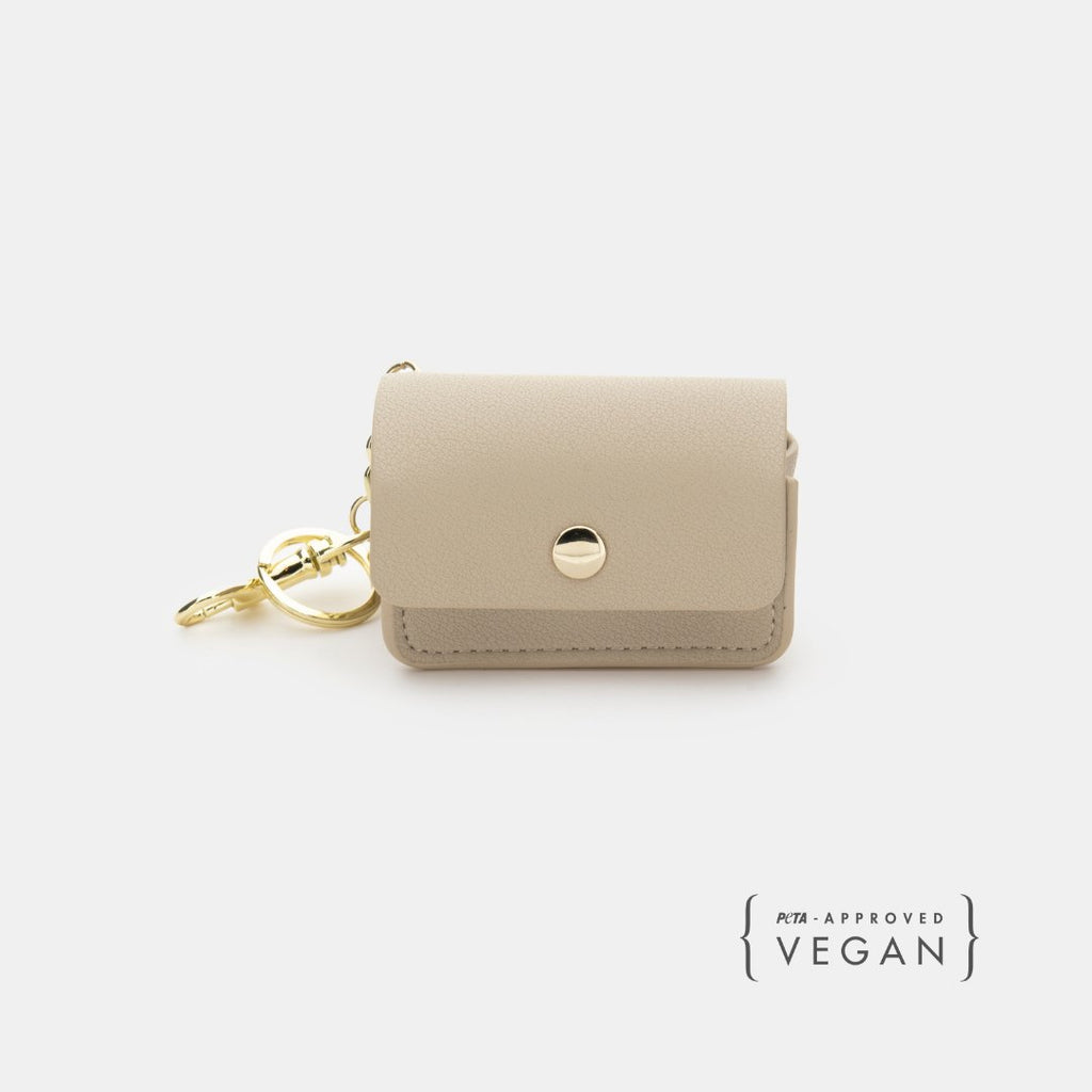 Beige vegan leather waste bag holder with snap button and gold keyring clip